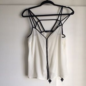 ⭐3/10⭐ Creamy camisol with black accent